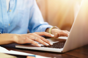 Woman typing on computer